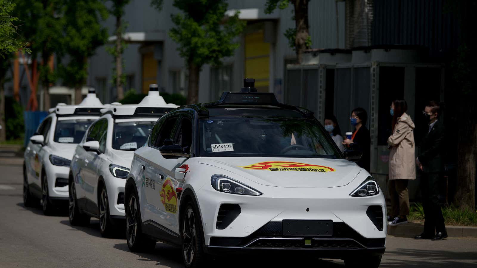 &quot;Robotaxi&quot; autonomous vehicles by Baidu Apollo drive at the Baidu Apollo Park in Beijing on April 22, 2022.