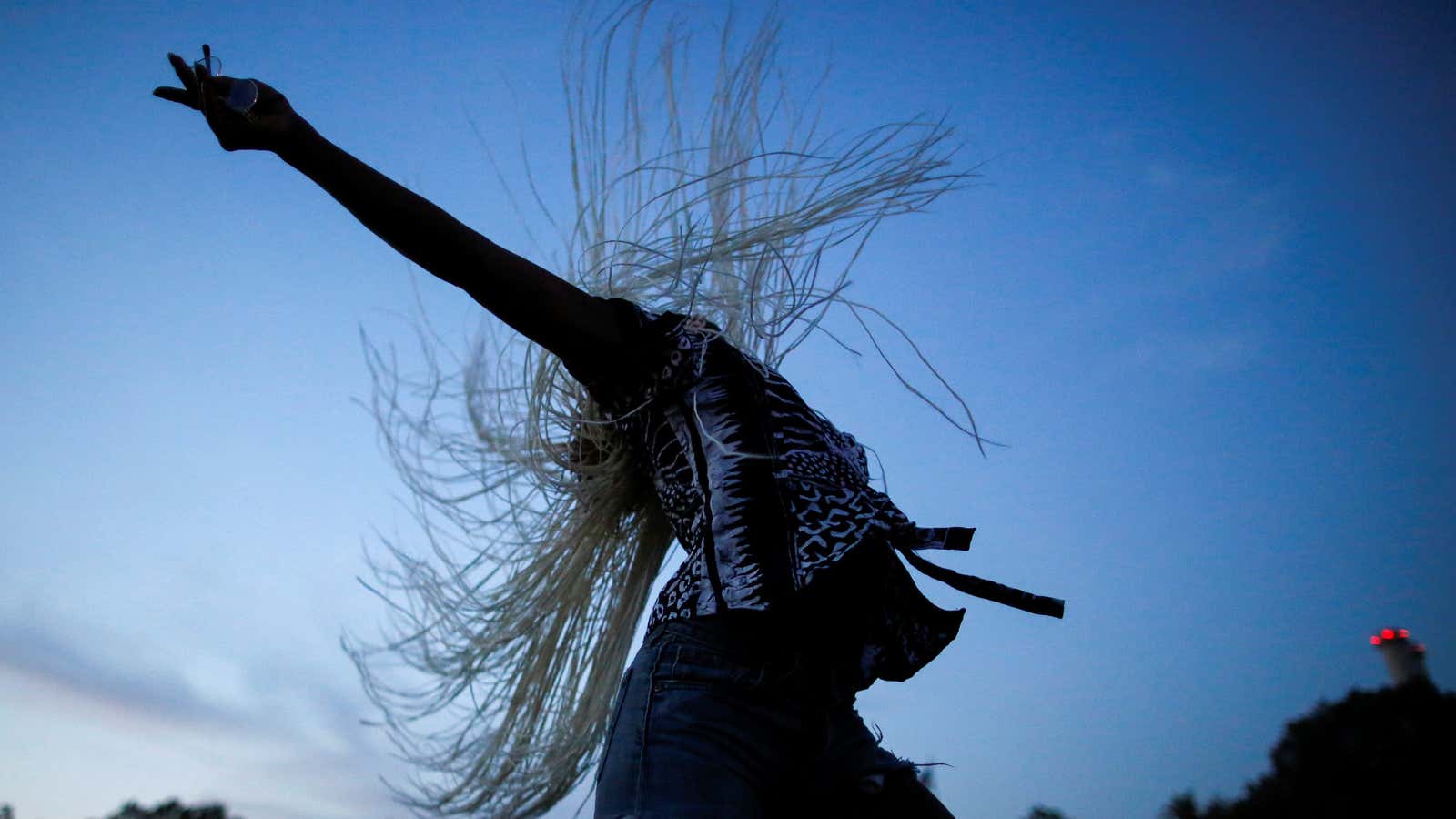 A woman dances as she takes part in the Annual Afropunk Music festival in Brooklyn, New York