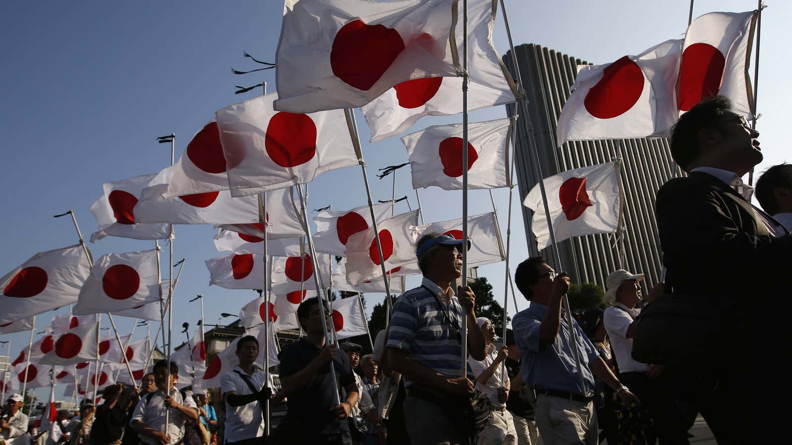 Members of a Japanese nationalist movement march at the Yasukuni Shrine in Tokyo.