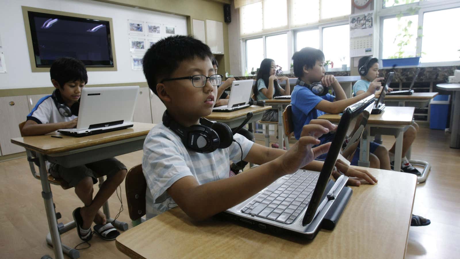 Students in South Korea adopt PCs and ditch textbooks as part of a vast digital scholastic network.