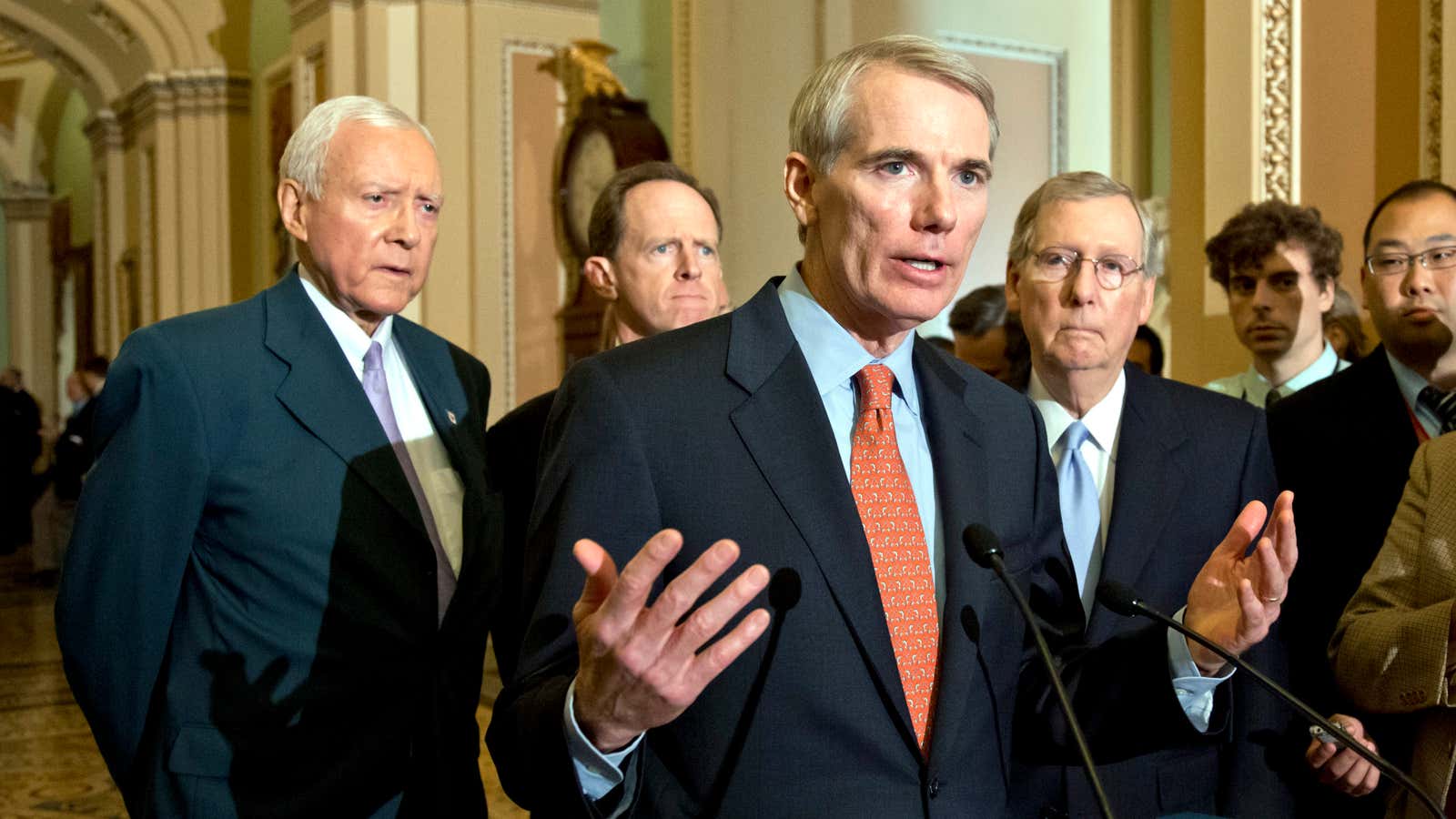 Senators Orrin Hatch (L) and Rob Portman (R) could force Republican leader Mitch McConnell (R) to reveal his secret bill.