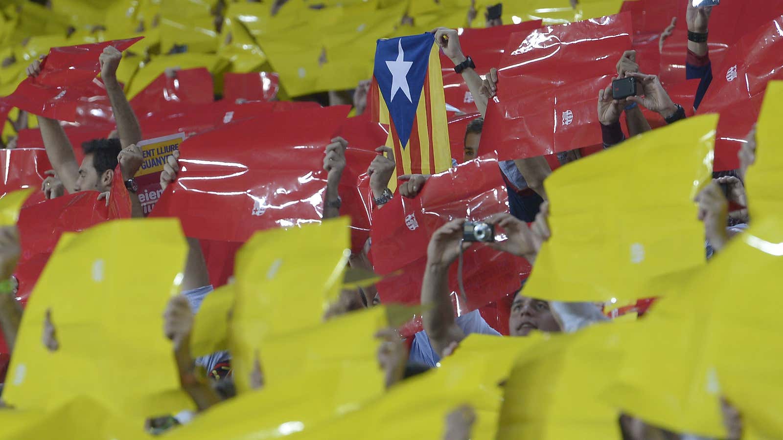 Football fans chant for “¡Barça!” and Catalan independence