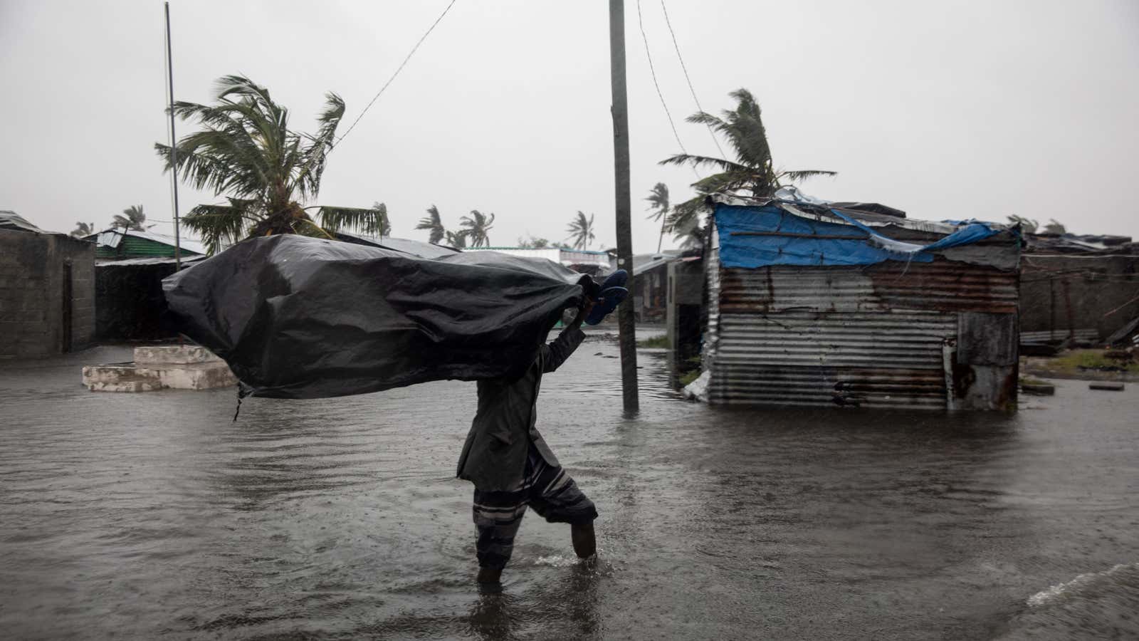 Residents of the Praia Nova neighbourhood seek shelter and protection from Tropical Cyclone Eloise, in Beira, Mozambique, Jan. 23, 2021.