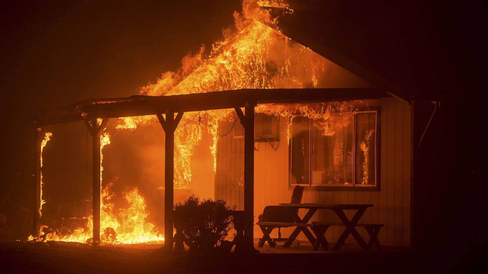 A house burns as the Butte Fire rages through Mountain Ranch, California.