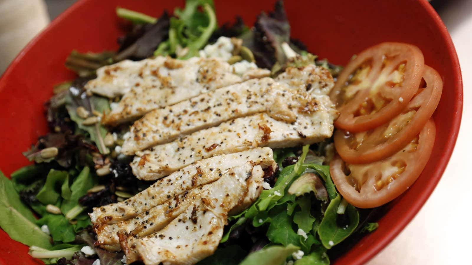 A harvest salad is prepared in the kitchen at a Smashburger restaurant in Culver City, California July 26, 2013.