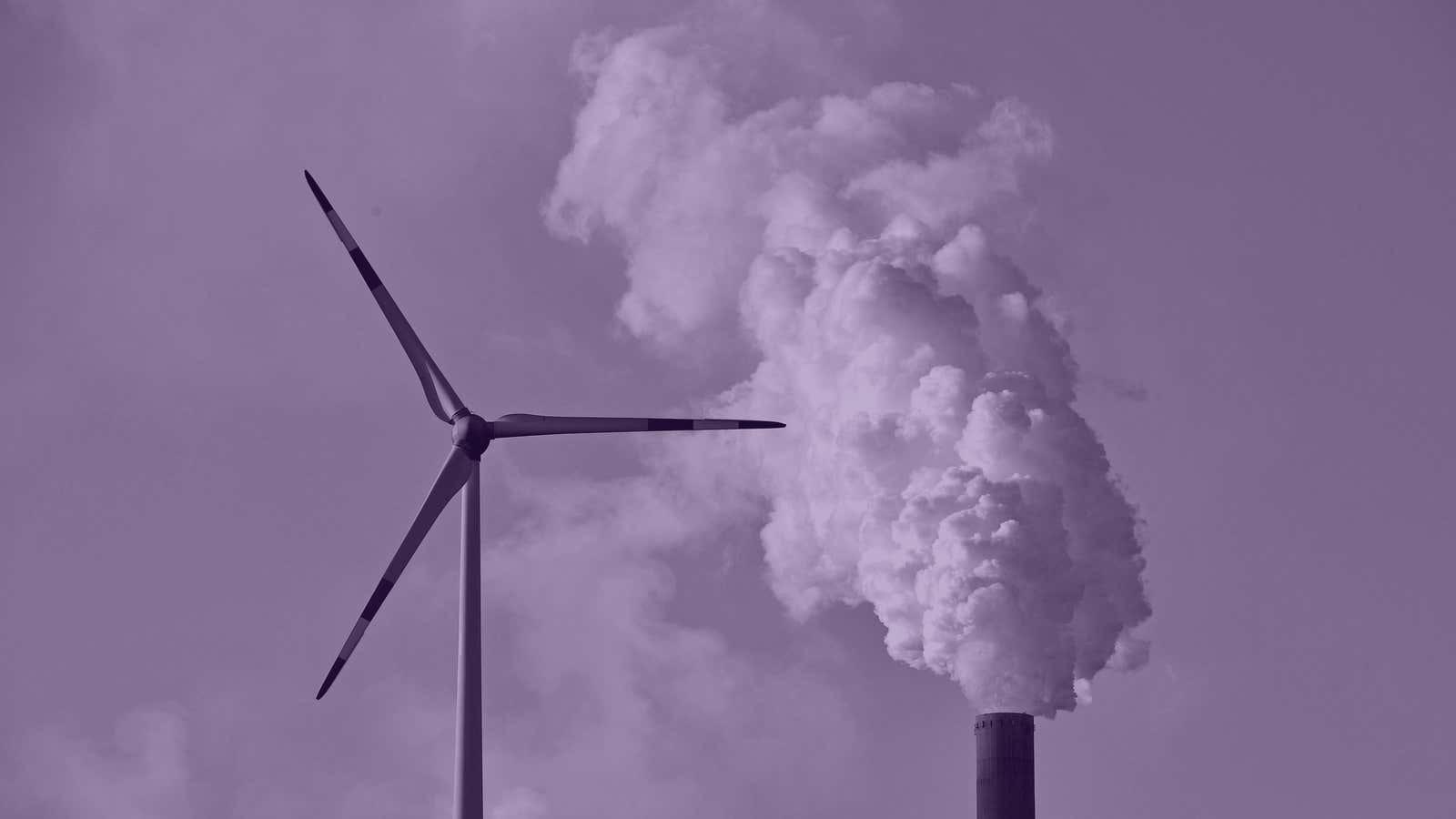 A coal-burning power plant steams behind wind generators in Gelsenkirchen, Germany while the 23rd UN Conference of the Parties (COP) climate talks end in Bonn,…