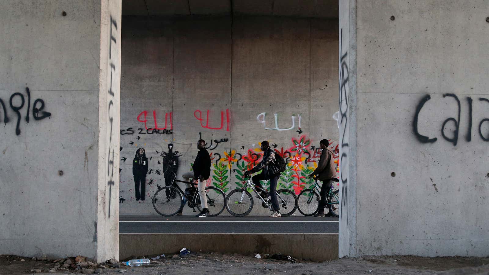 Migrants along a road in Calais, France.