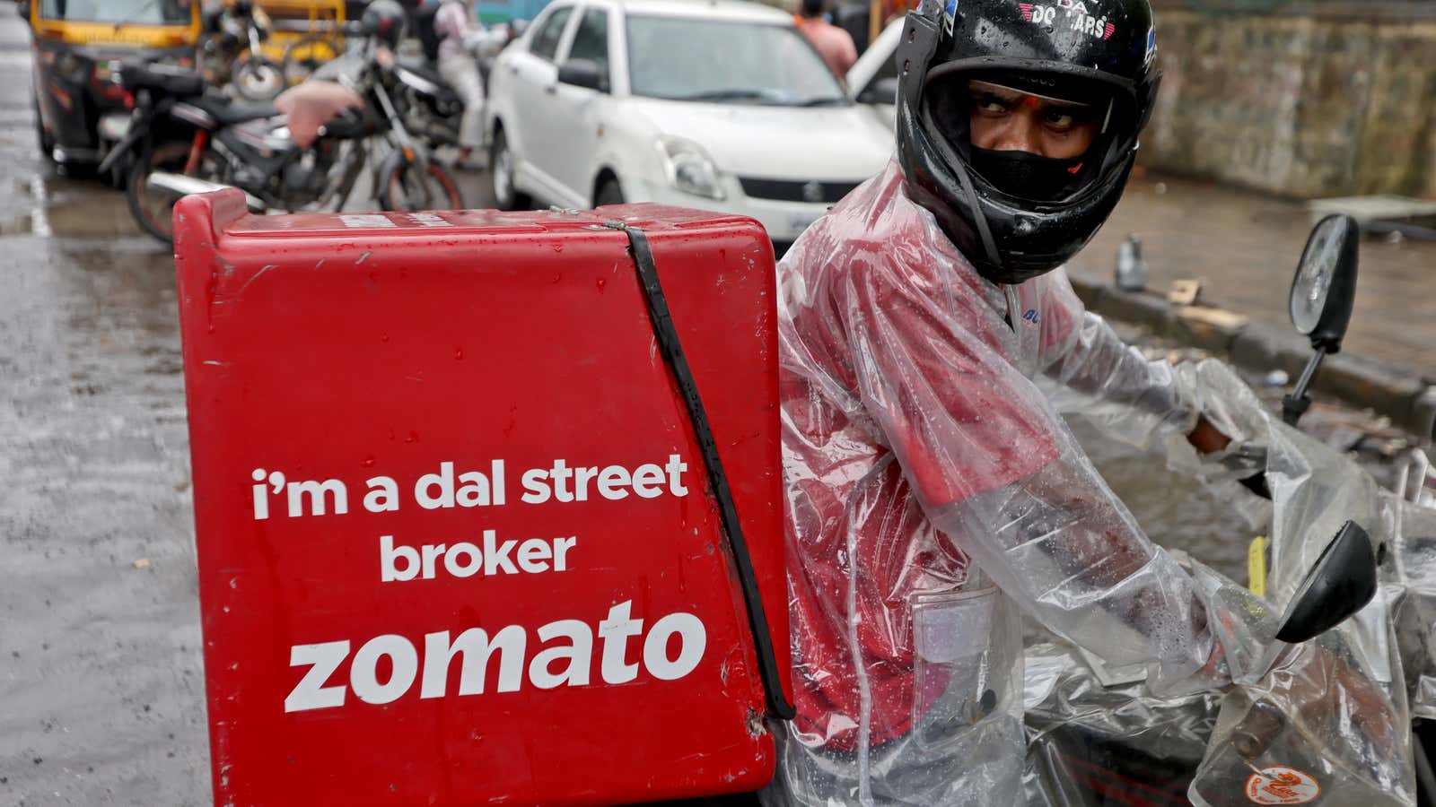 A delivery worker of Zomato, an Indian food-delivery startup, prepares to leave to pick up an order from a restaurant in Mumbai, India, July 13,…