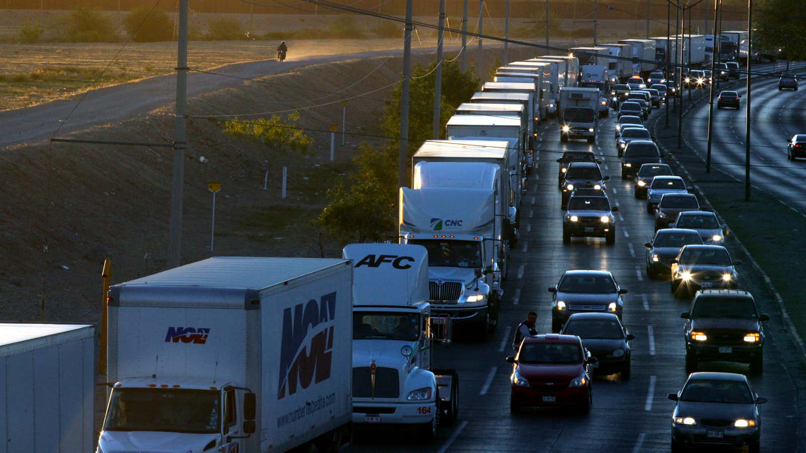 Trucks wait to cross the US-Mexico border in 2019.