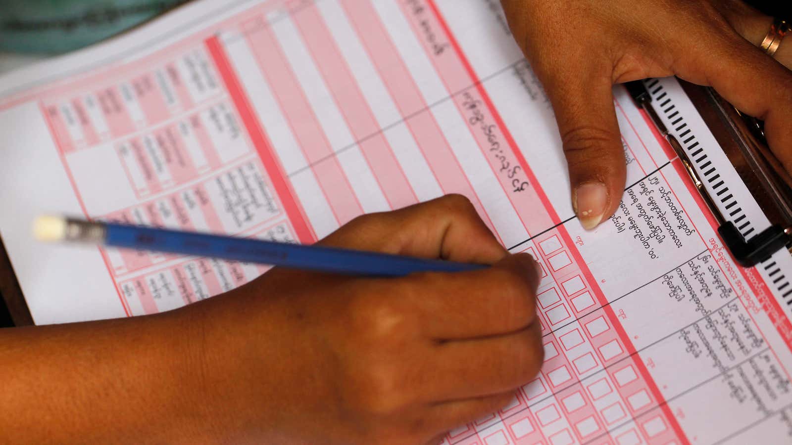 A volunteer collects data for a national census at a Rohingya village in Sittwe, the capital of Rakhine State April 1, 2014. The government embarked on its first national census in more than 30 years. The Rohingya are regarded as immigrants from neighbouring Bangladesh by many in Myanmar and are not recognised as one of the country’s official ethnic groups, but some have said they will write in their ethnicity in a box on the census form. That has stirred opposition to the whole census operation by some ethnic Rakhine people.  REUTERS/Soe Zeya Tun (MYANMAR – Tags: POLITICS SOCIETY) – GM1EA41166S01