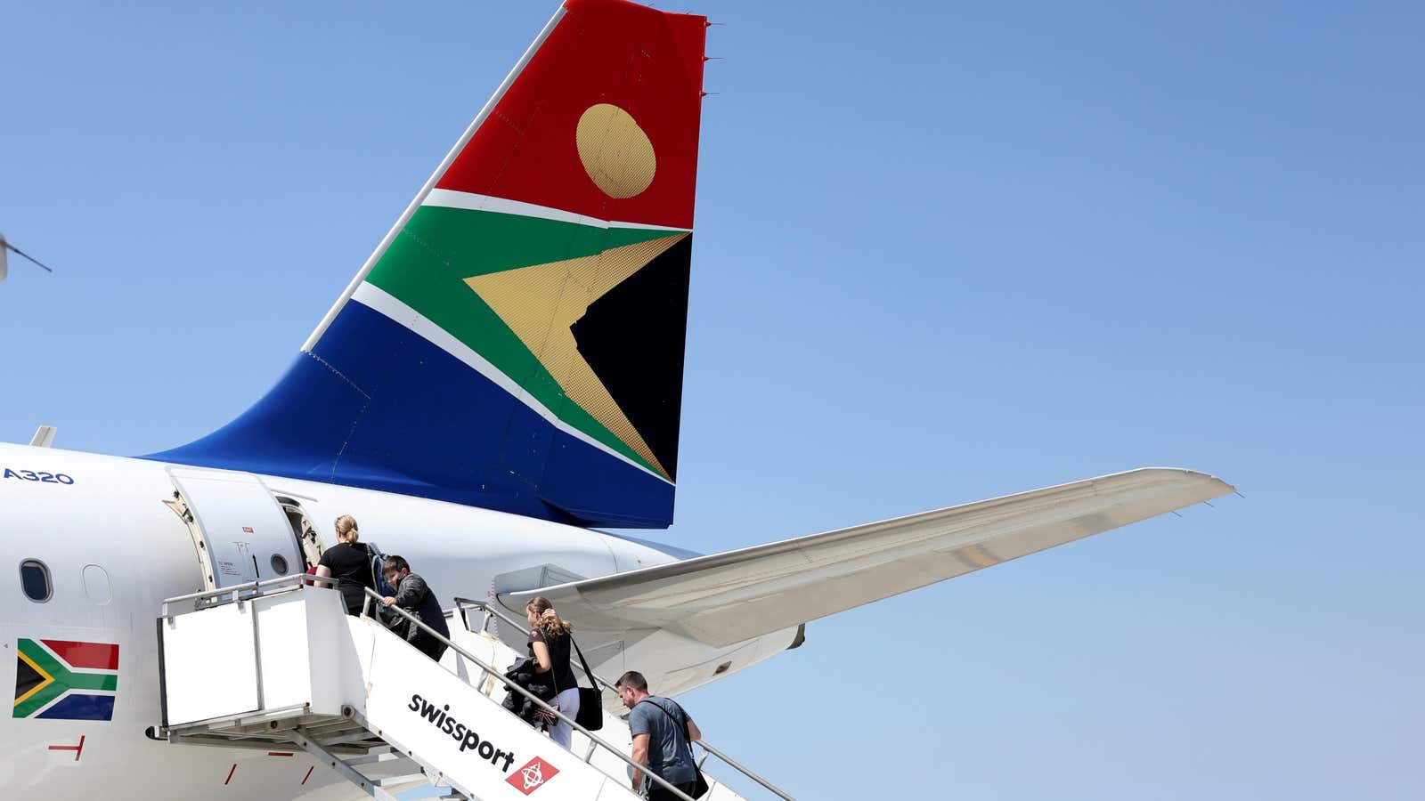 Passengers board a South African Airways plane