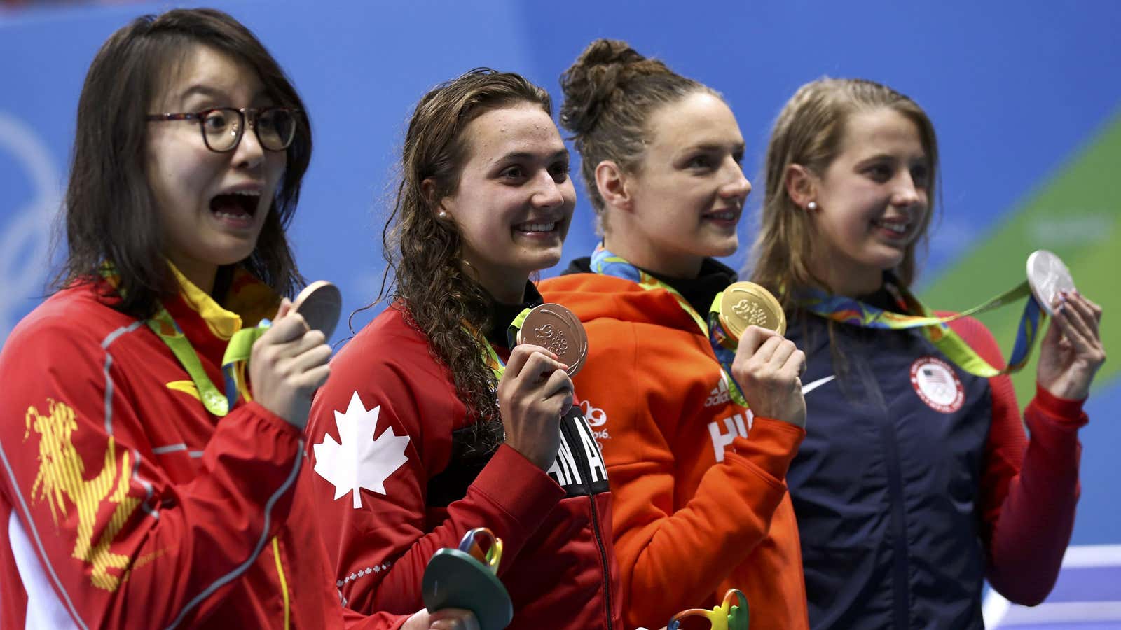 Fu Yuanhui (left) wins a bronze in the women’s 100-m backstroke.