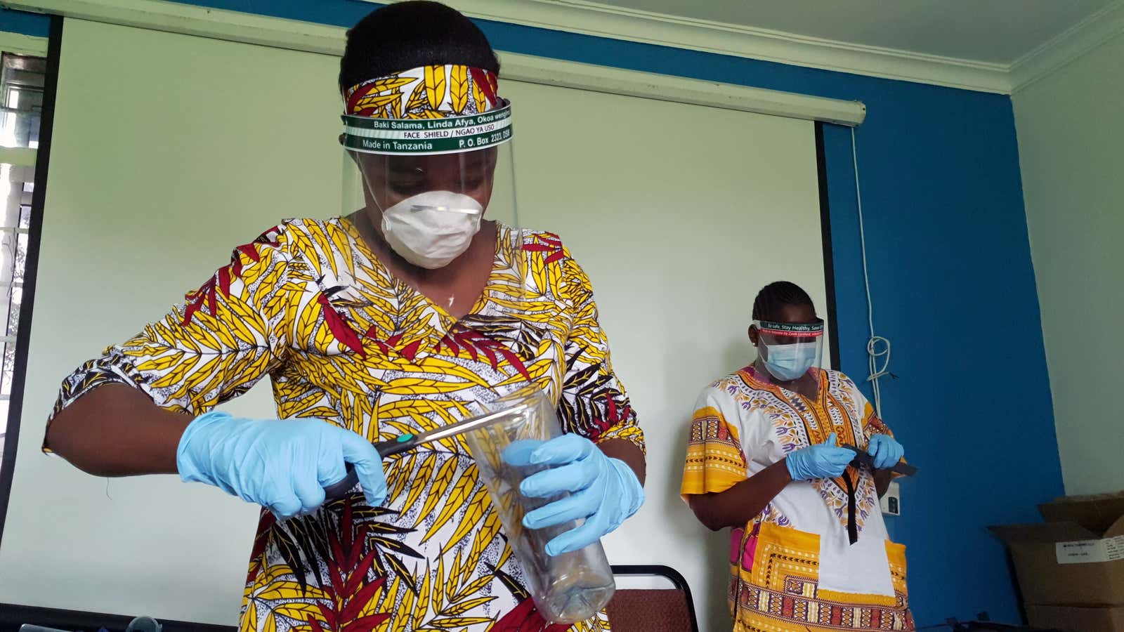 At the height of covid denials, health workers in Dar es Salaam prepared face shields from recycled plastics at the Zaidi Recyclers workshop.