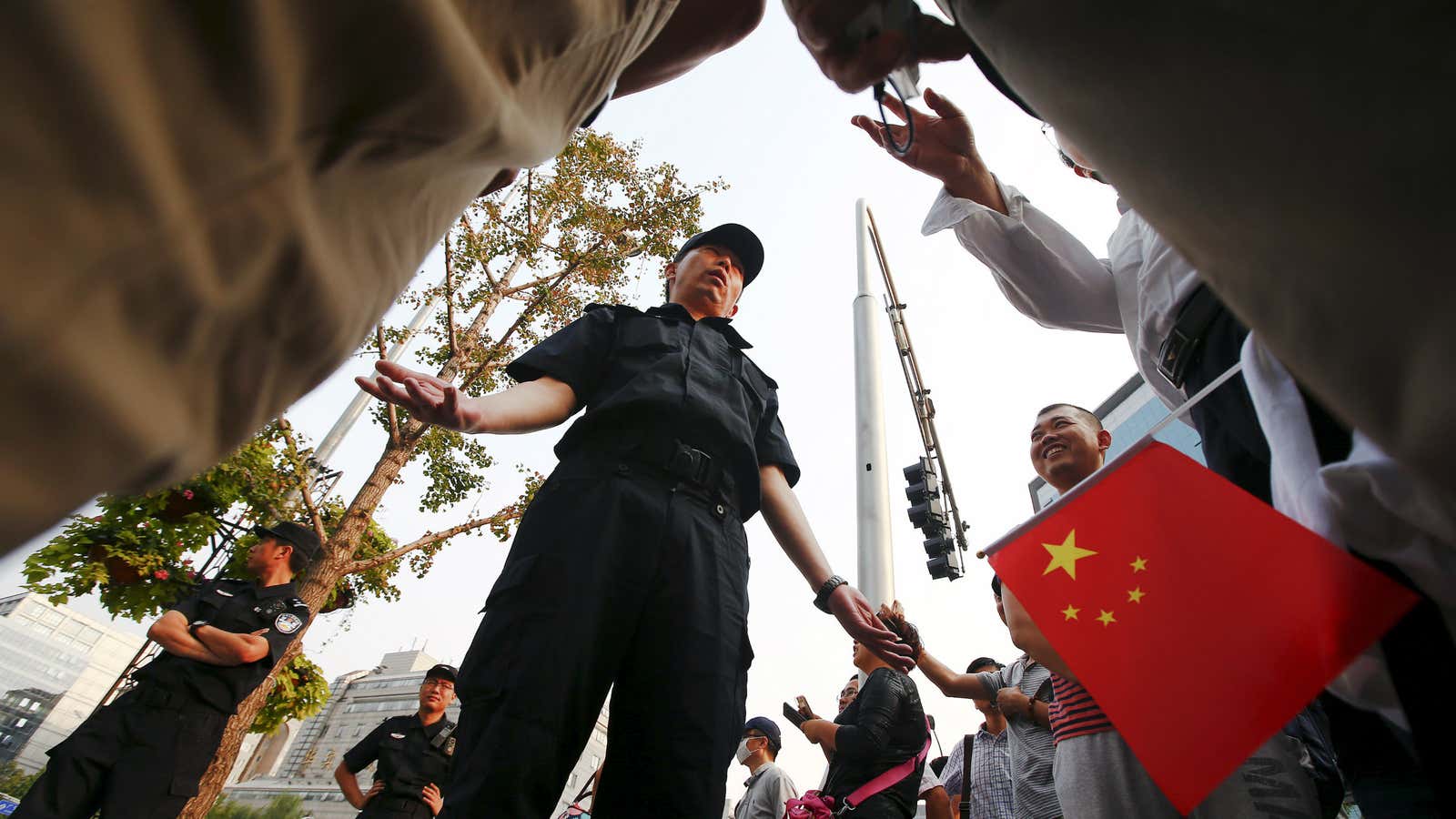 Fanya investors discuss their case with police at an earlier protest.