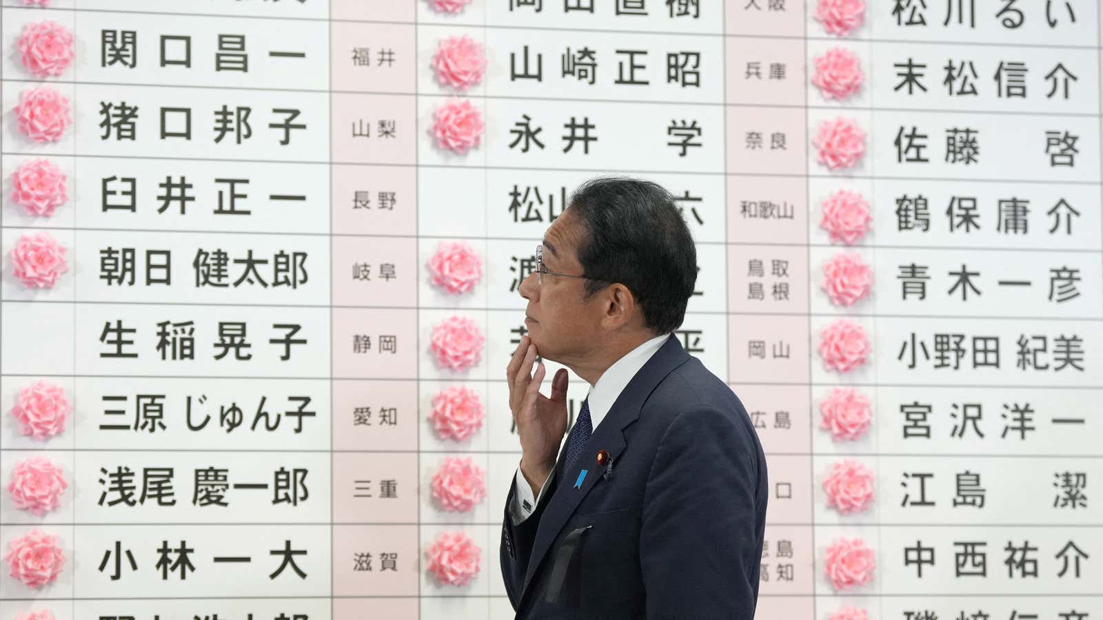 Fumio Kishida, Japan’s Prime Minister and president of the Liberal Democratic Party (LDP), reacts after placing a paper rose on an LDP candidate’s name, to indicate a victory in the upper house election.