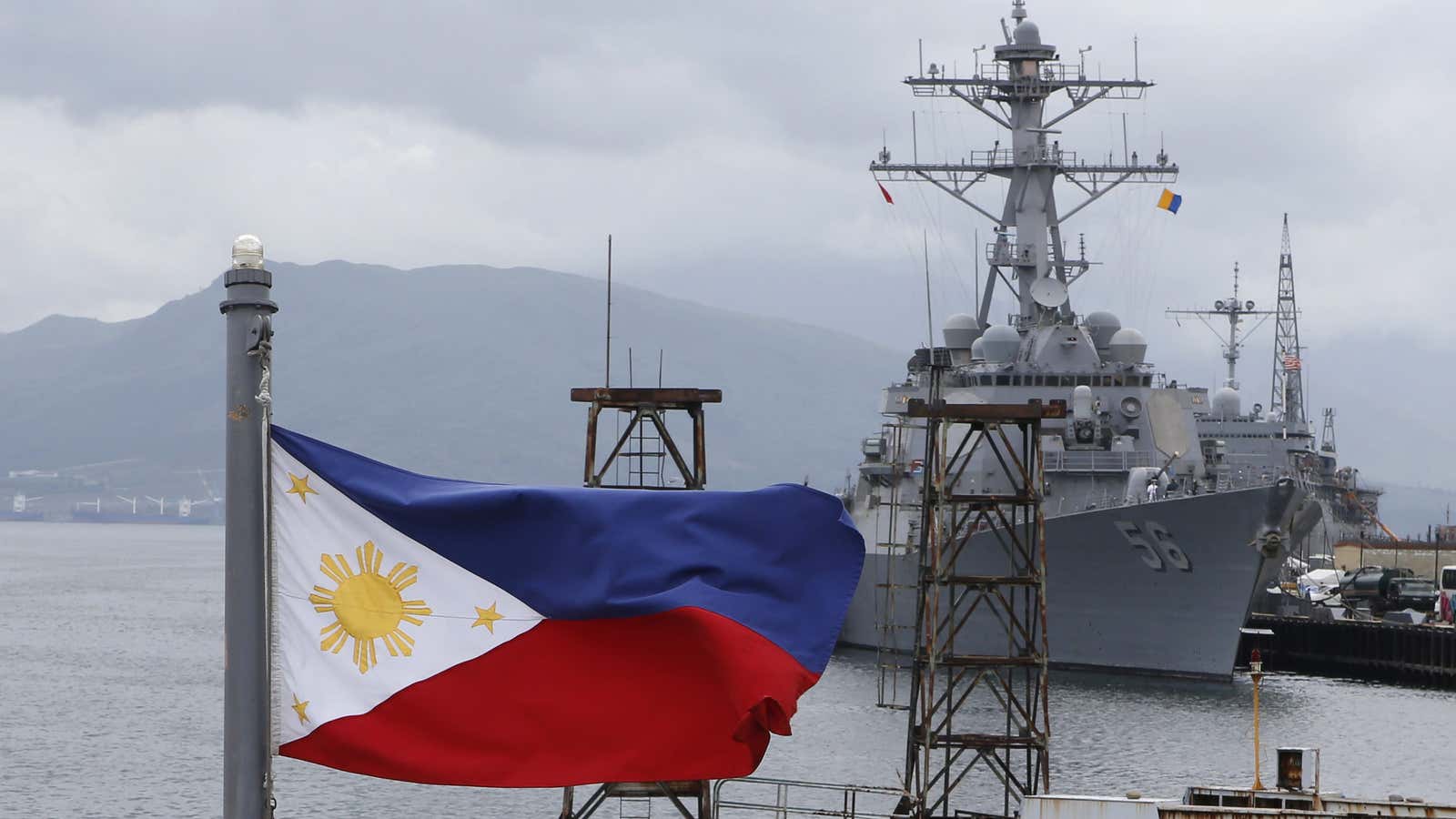 A Philippine flag overlooking US warship USS John S. McCain at Subic Bay.