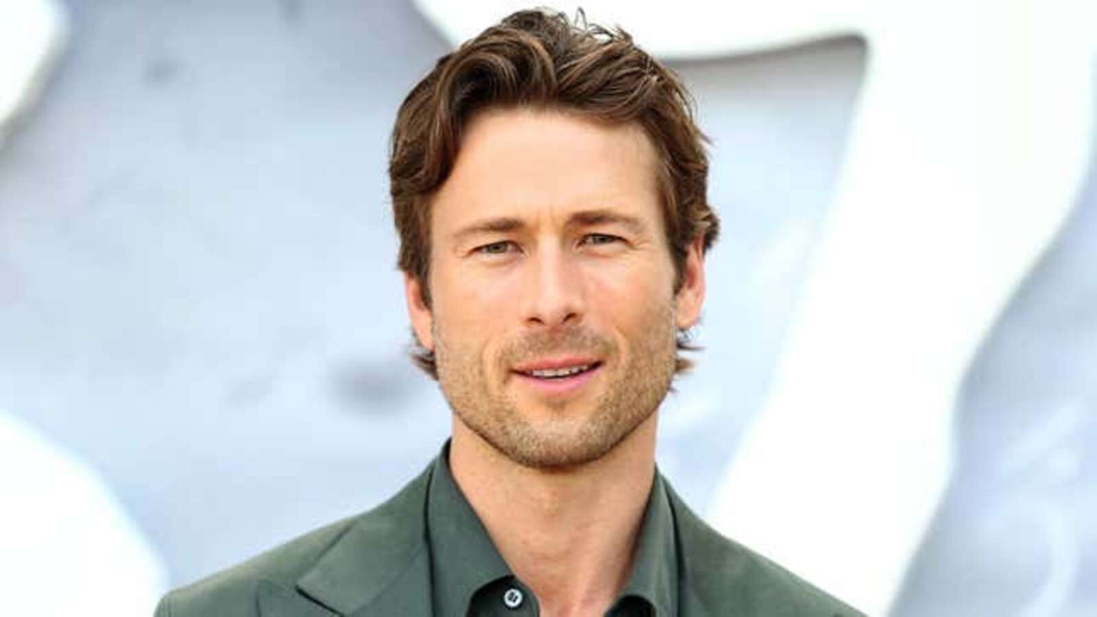 Image for Report: 78% Of Americans Too Distracted By Politics To Appreciate The Summer Glen Powell Is Having