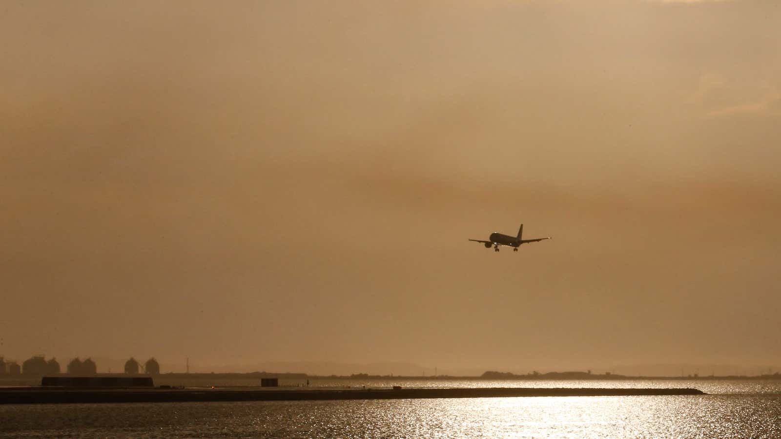 A plane flies over the Etang de Berre as it prepares to land on the tarmac of Marseille Provence Airport in Marignane, southern France, June…