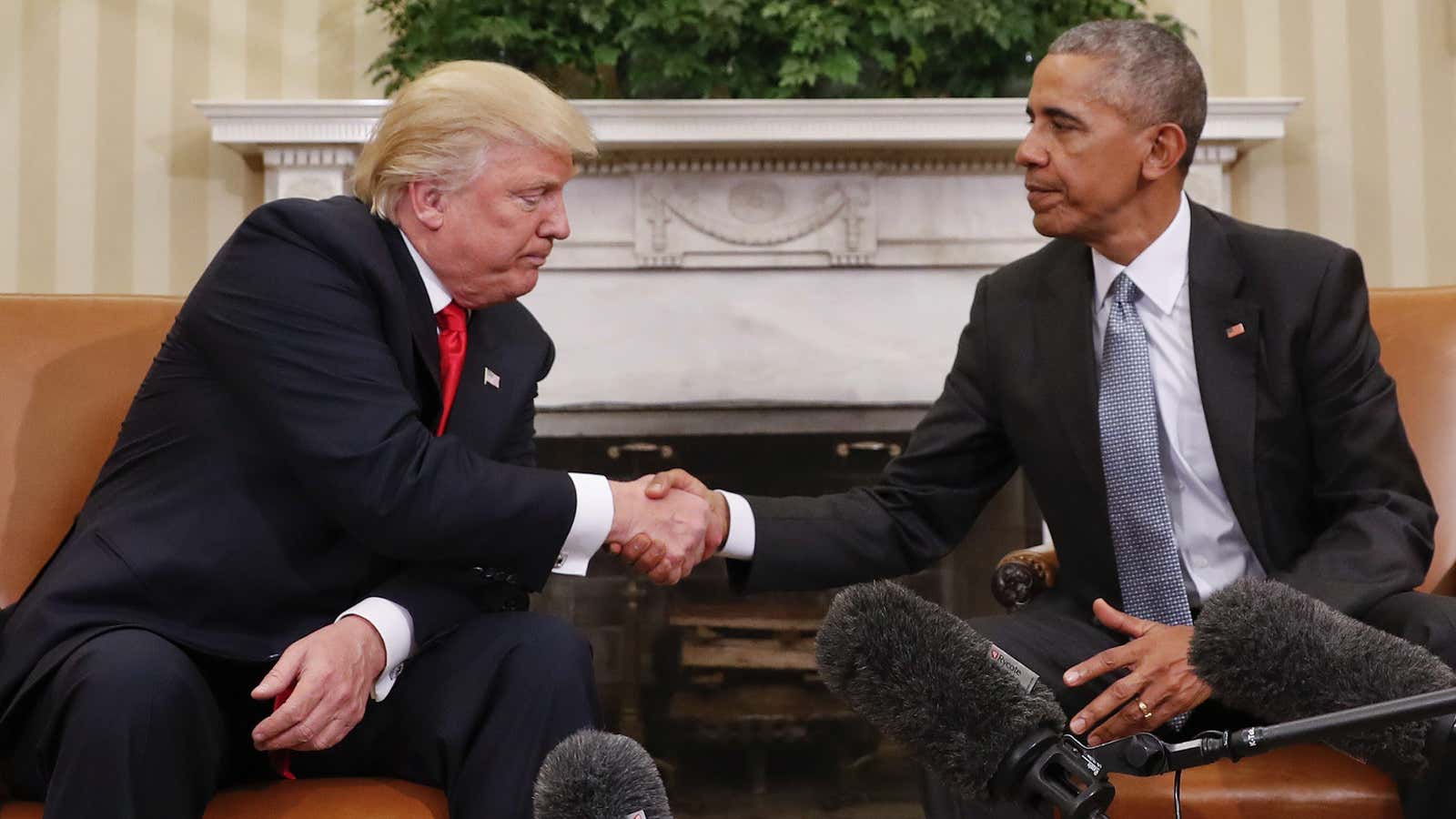 In this Nov. 10, 2016 photo, President Barack Obama and President-elect Donald Trump shake hands following their meeting in the Oval Office of the White…