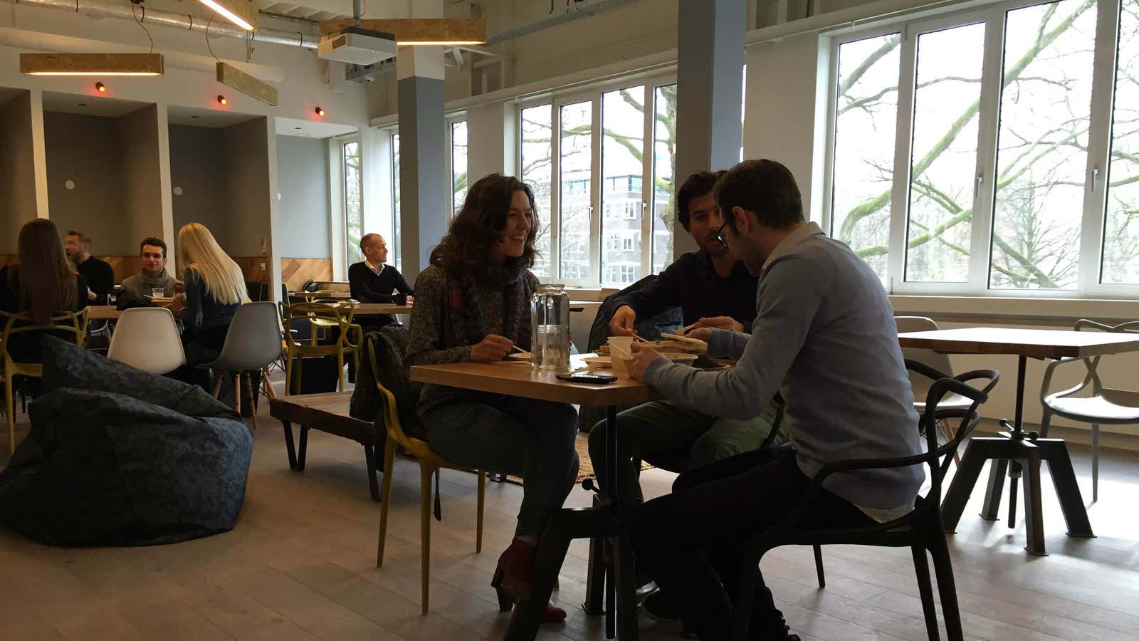 WeWork members having lunch in the new Amsterdam office.