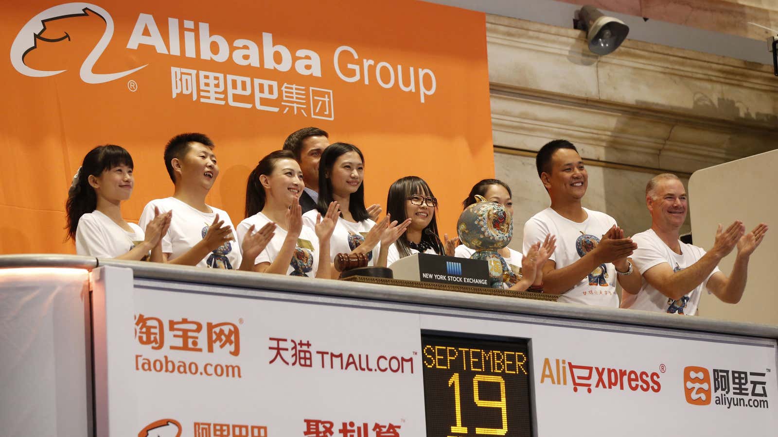 Alibaba employees cheer Jack Ma as he rings NYSE’s opening bell.