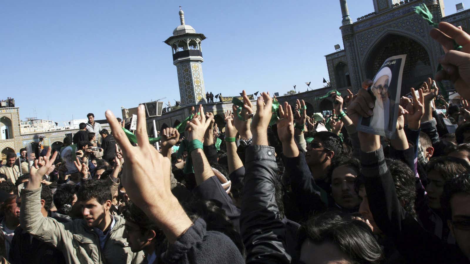 Supporters of the Iranian opposition movement wear green during the funeral of Grand Ayatollah Hossein Ali Montazeri in the holy city of Qom Dec. 21, 2009.