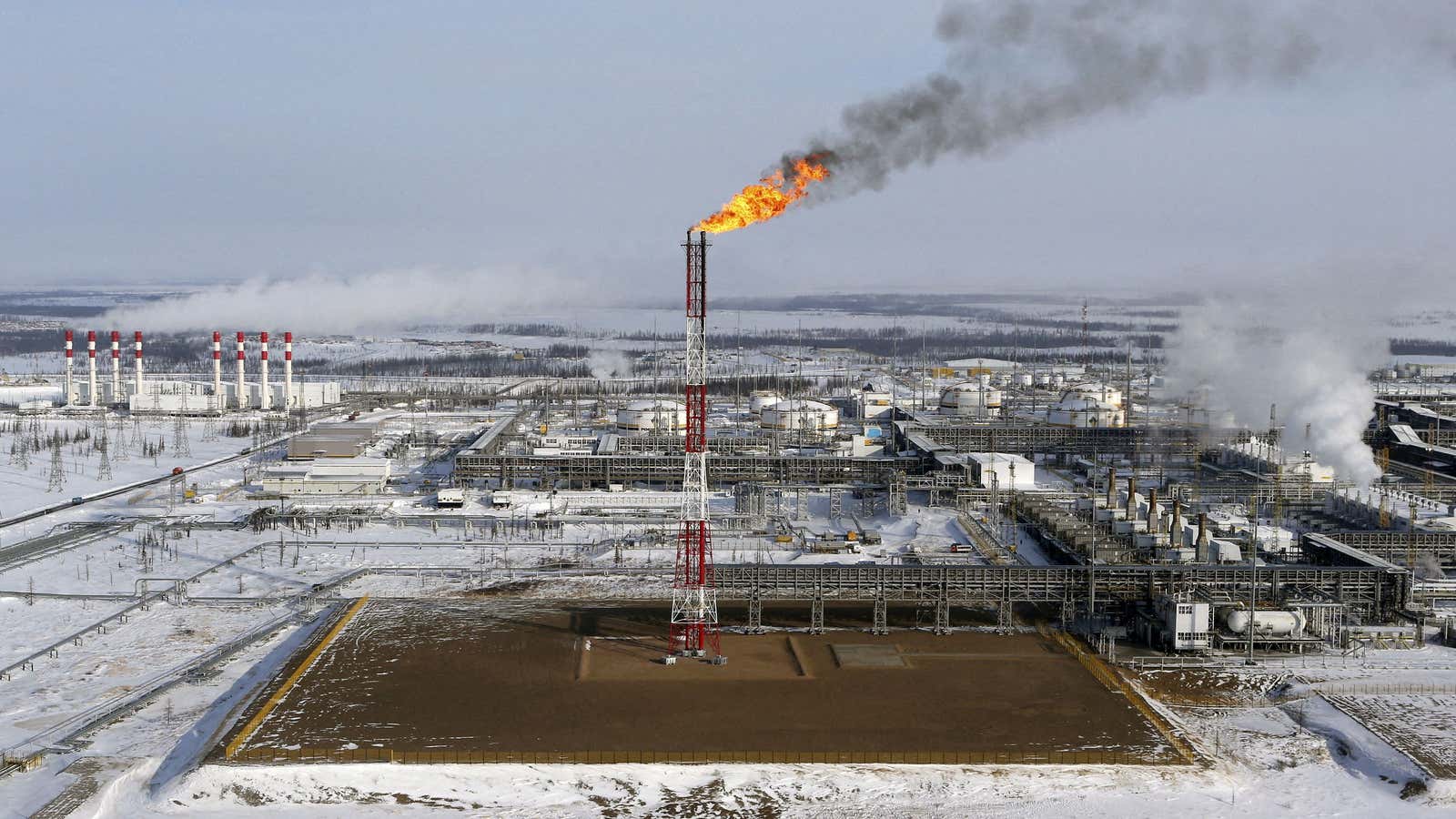 A flame burns from a tower at Vankorskoye oil field owned by Rosneft company north of the Russian Siberian city of Krasnoyarsk.