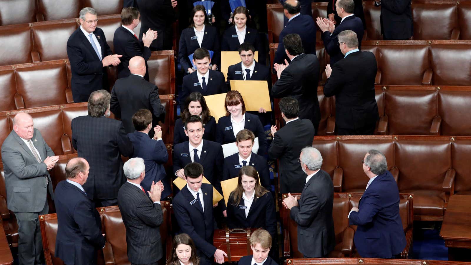 Congressional pages carry in cases the Electoral College votes on  January 6, 2017. REUTERS/Aaron P. Bernstein