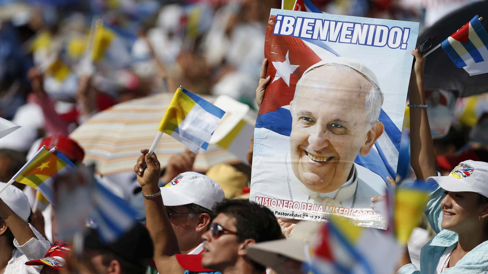 Catholic faithful cheer during the arrival of Pope Francis, who held mass in Holguín, Cuba, on Sep. 21, 2015.