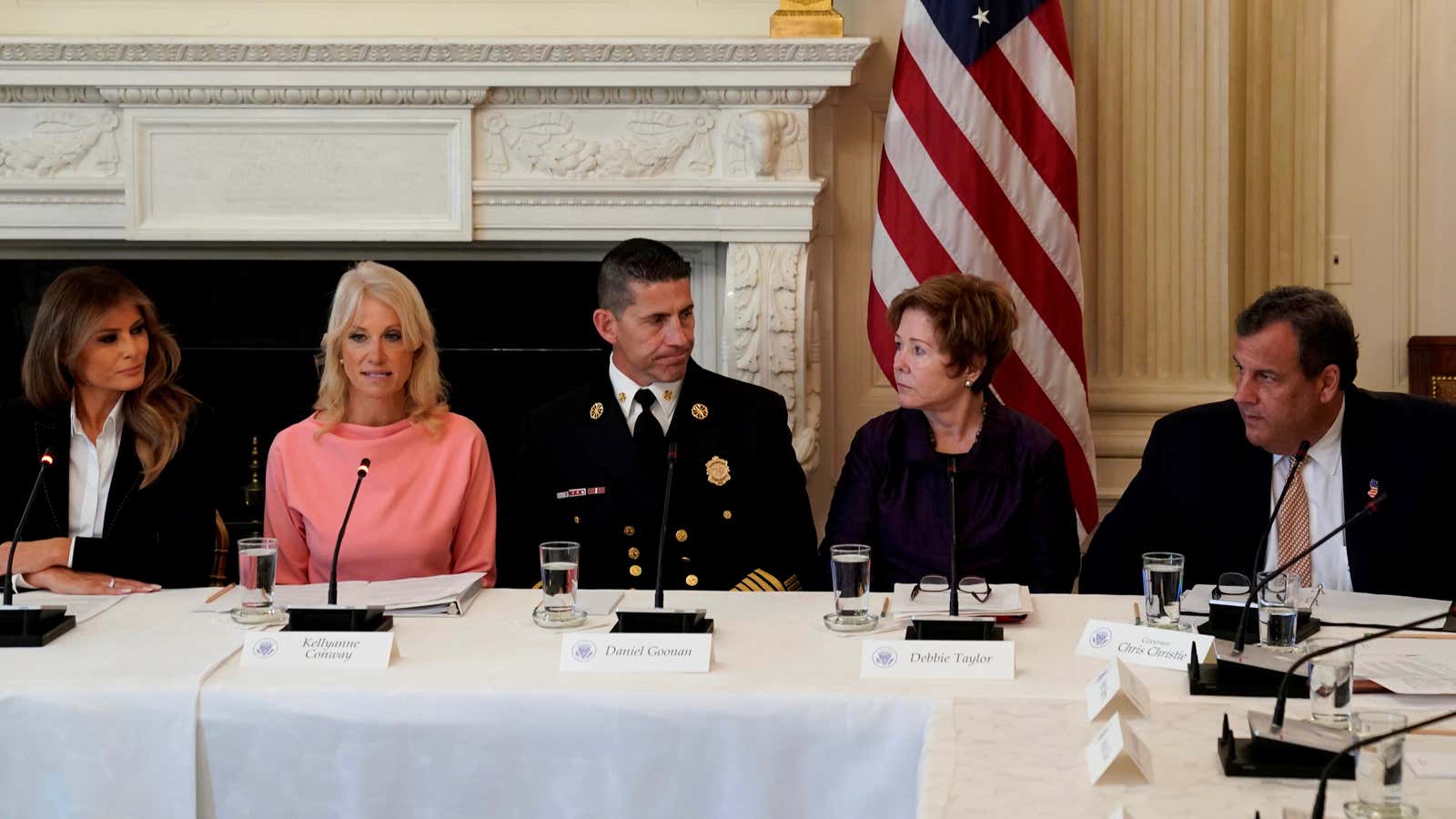 Melania Trump and New Jersey Governor Chris Christie flank experts in a discussion on the opioid crisis at the White House in Washington on Sept. 28.