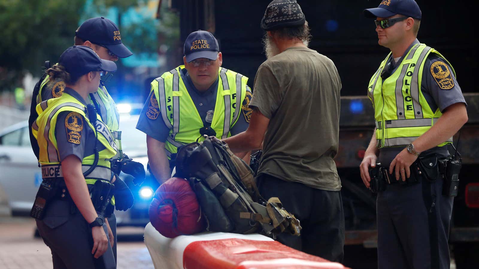 Police searching bags in Charlottesville, a year after deadly violence.