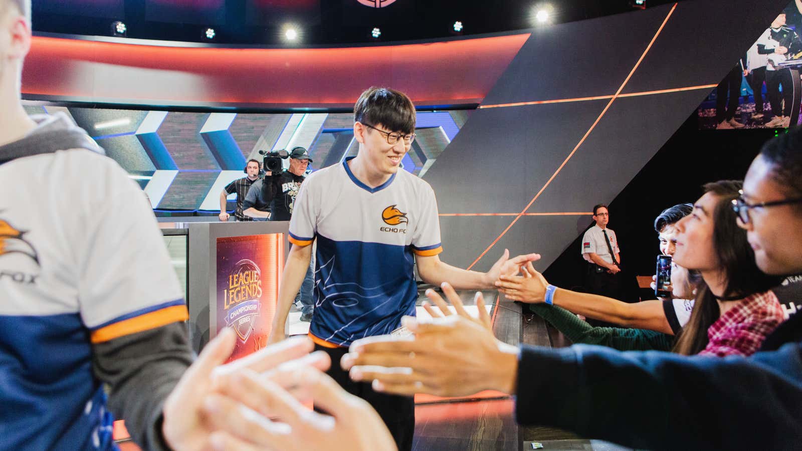 Rush from Echo Fox high-fives the crowd after their winning match at the League of Legends tournament at Riot Studios on Sunday.