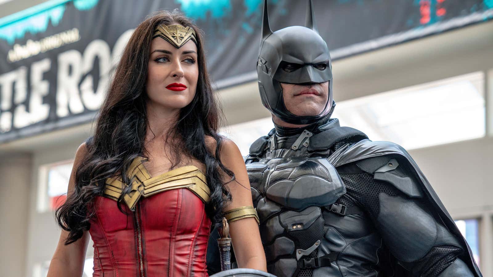 Jessica Davis and Armando Abarca from Los Angeles, CA dressed as Wonder Woman and Batman pose on day one of Comic-Con International on Thursday, July…