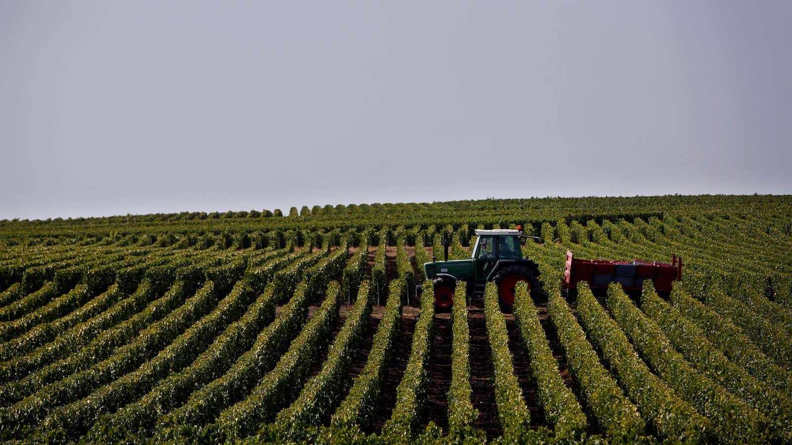 Climbing into a tractor.