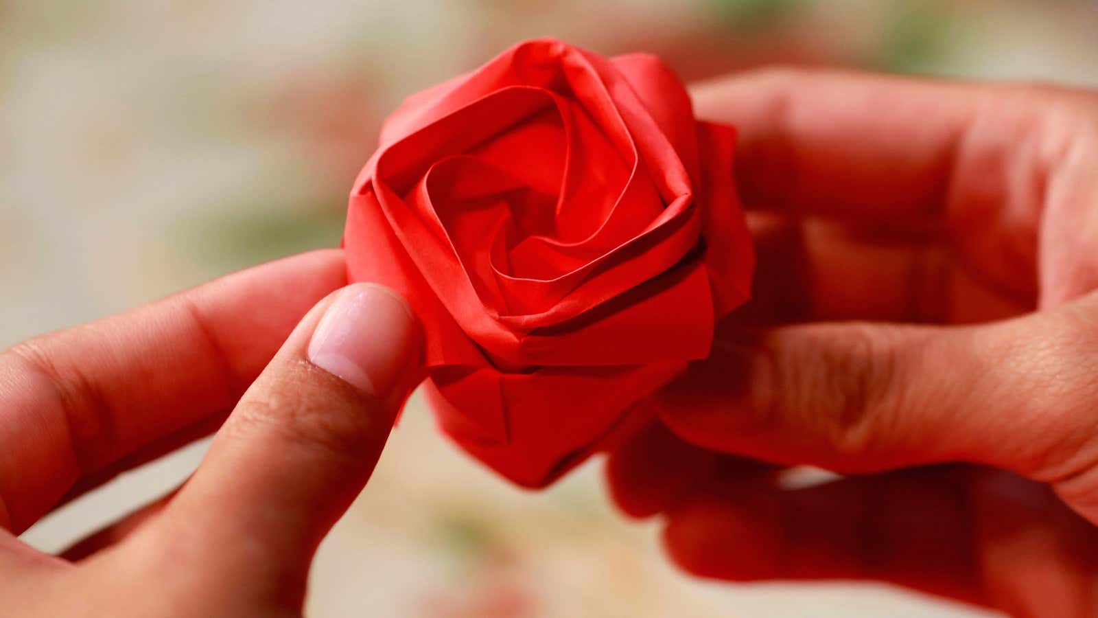 A Filipino entrepreneur makes an origami flower to be sold ahead of Valentines Day, in Quezon City, Philippines, February 13, 2019.