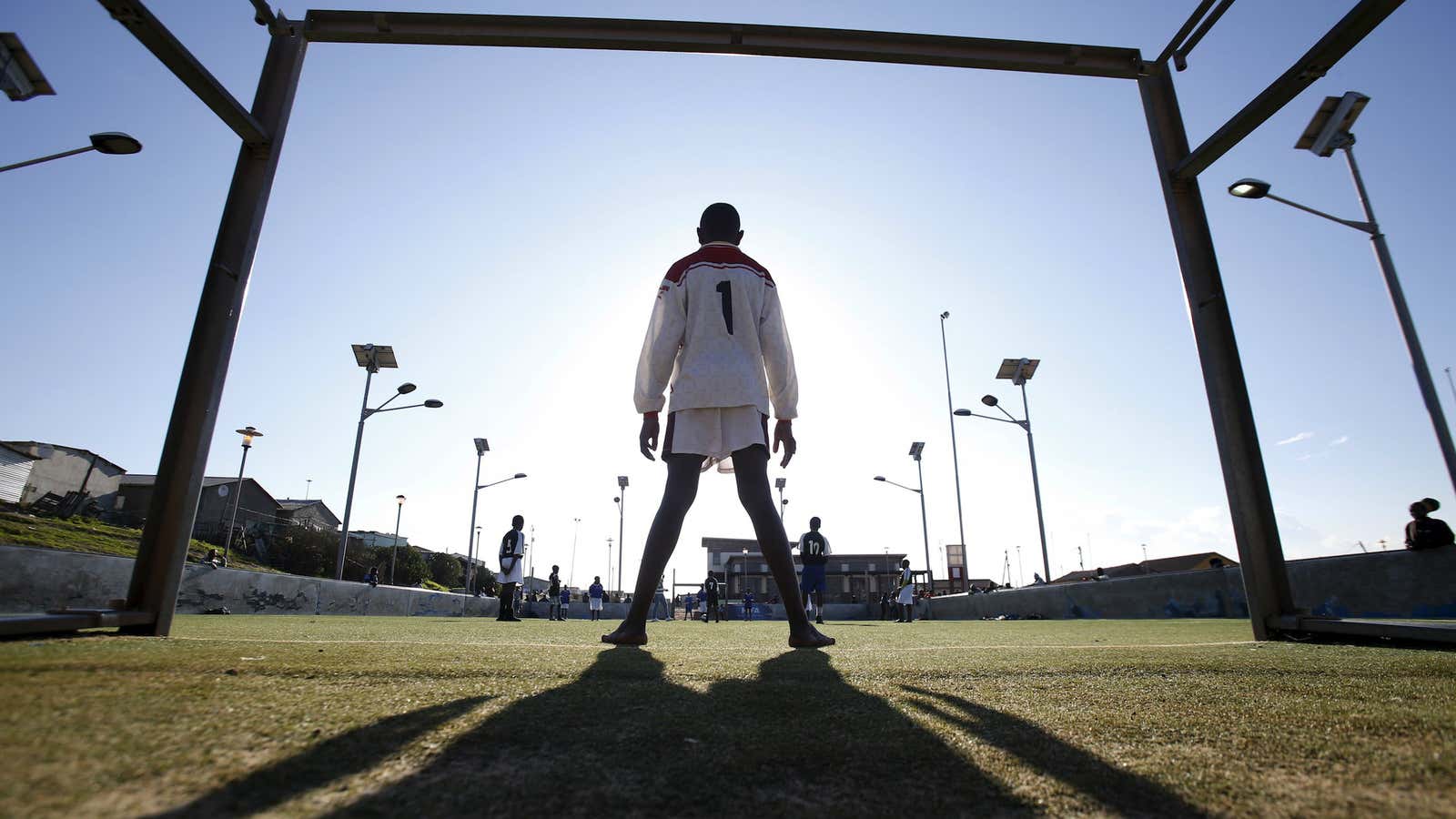 A boy plays football in Cape Town’s Khayelitsha township.