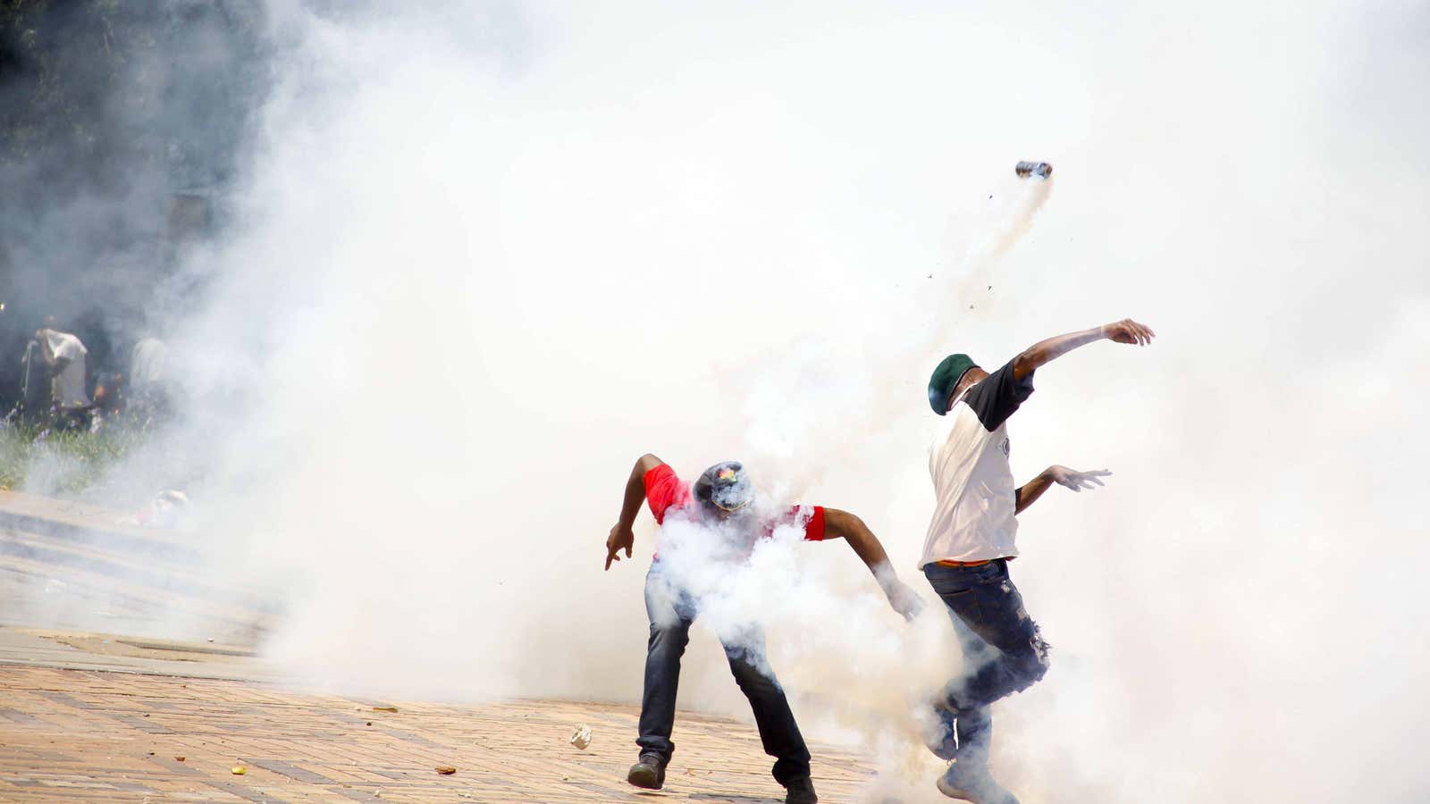 A student dances in front of a burning bus as violence between University of Witwatersrand students and police spill in to Braamfontein during the Fees Must Fall protest. 
Rosetta Msimango, 26 years old.
Vosloorus, South Africa.