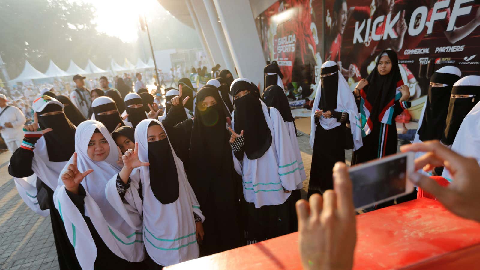 Women attend a rally for Prabowo Subianto.