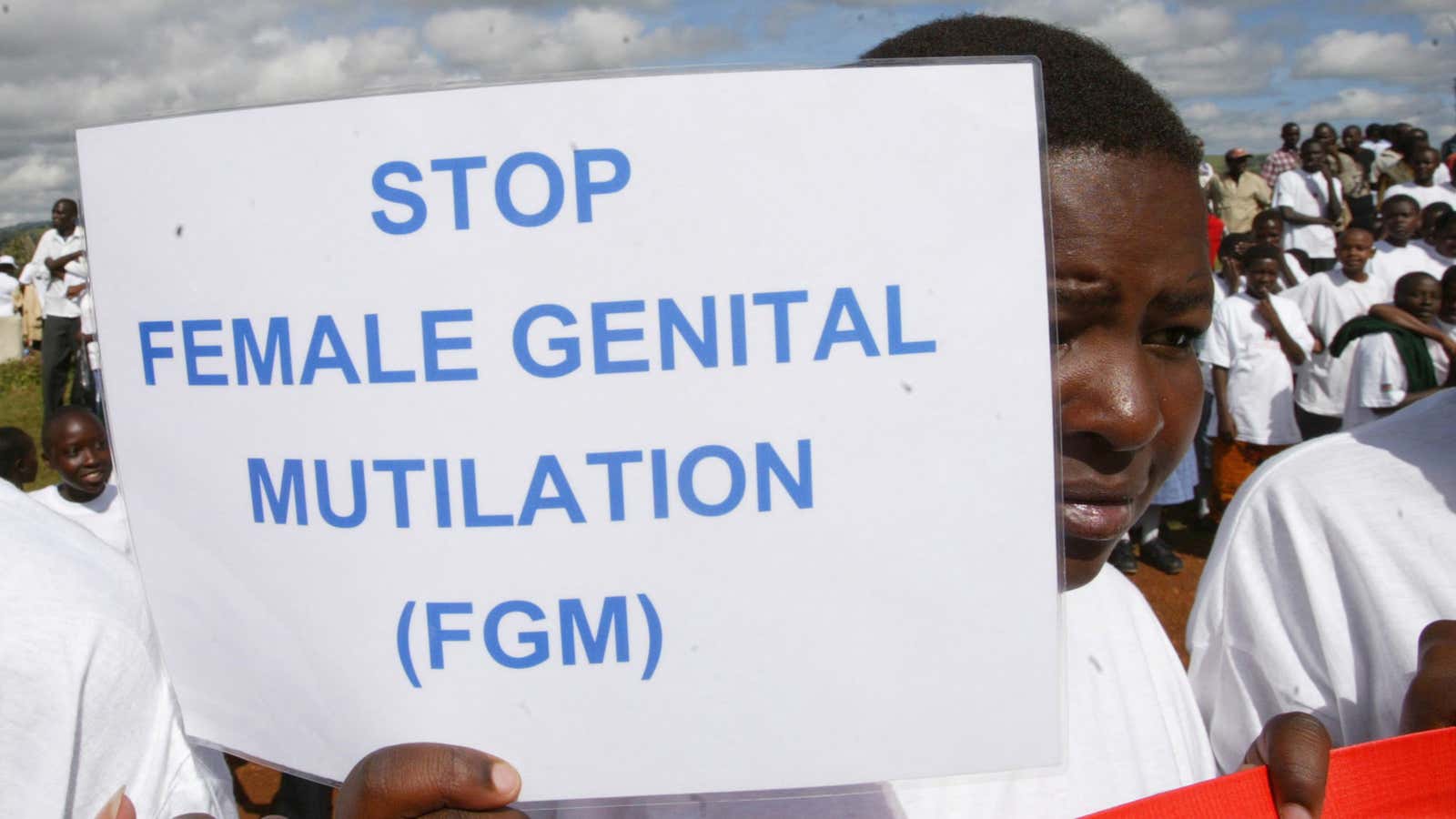 A Masai girl holds a protest sign in Kilgoris, Kenya.