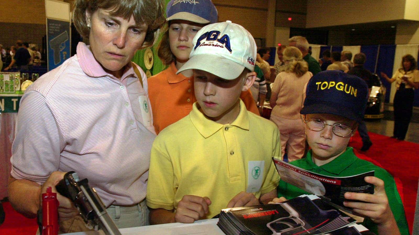 The NRA tells delegates to bring their kids along, as this mother did in 2000.