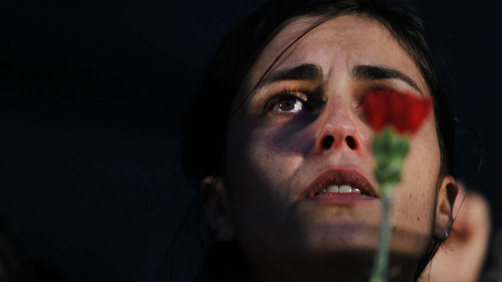 A woman sings a protest song against austerity policies in Portugal. Economics is on her side.