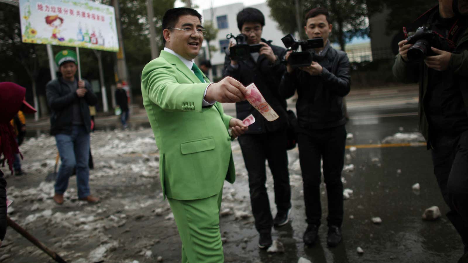 Multimillionaire Chen Guangbiao: looking sharp while handing out his riches.