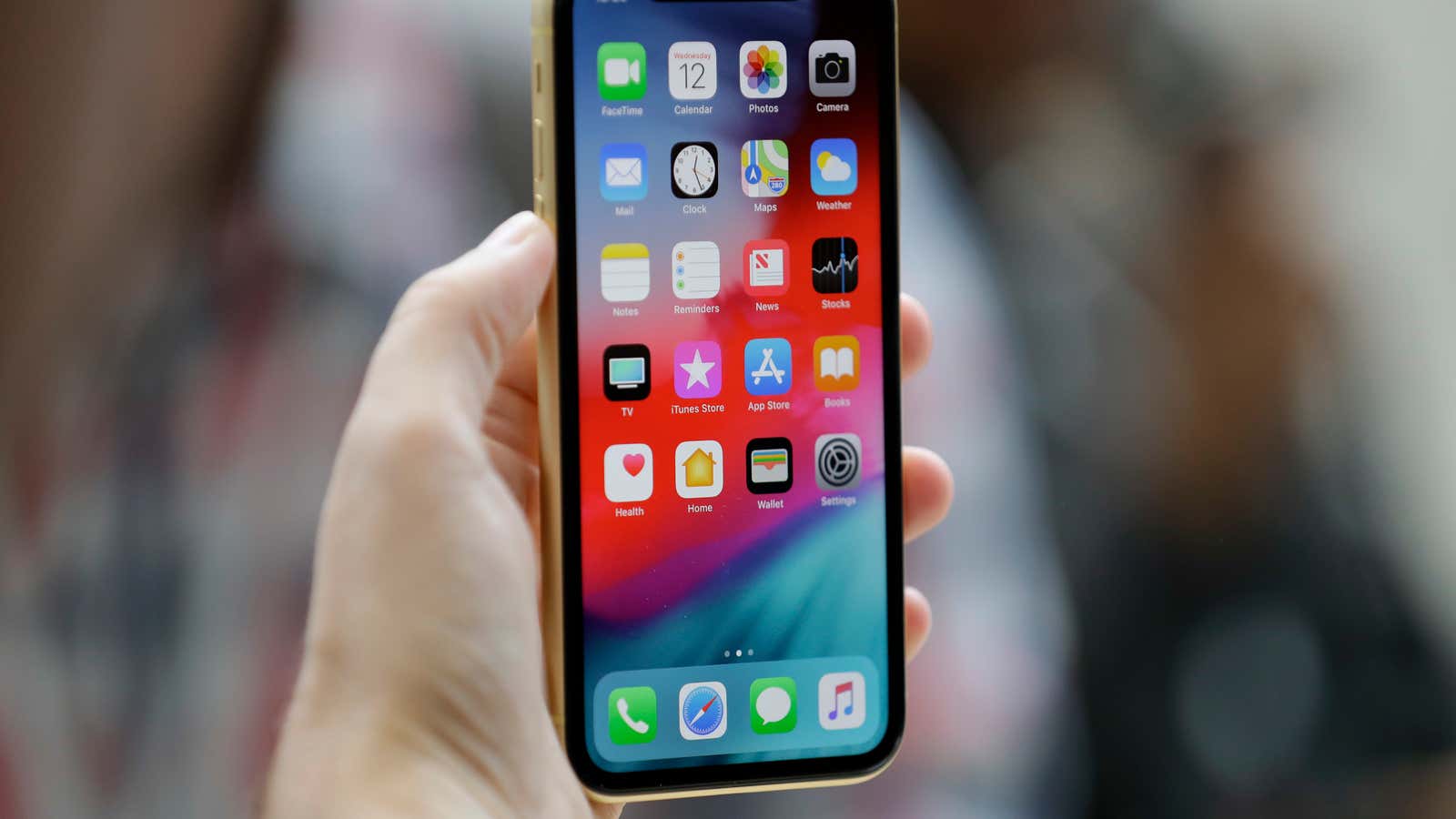 The new Apple iPhone XR is on display at the Steve Jobs Theater after an event to announce new products Wednesday, Sept. 12, 2018, in Cupertino, Calif. (AP Photo/Marcio Jose Sanchez)