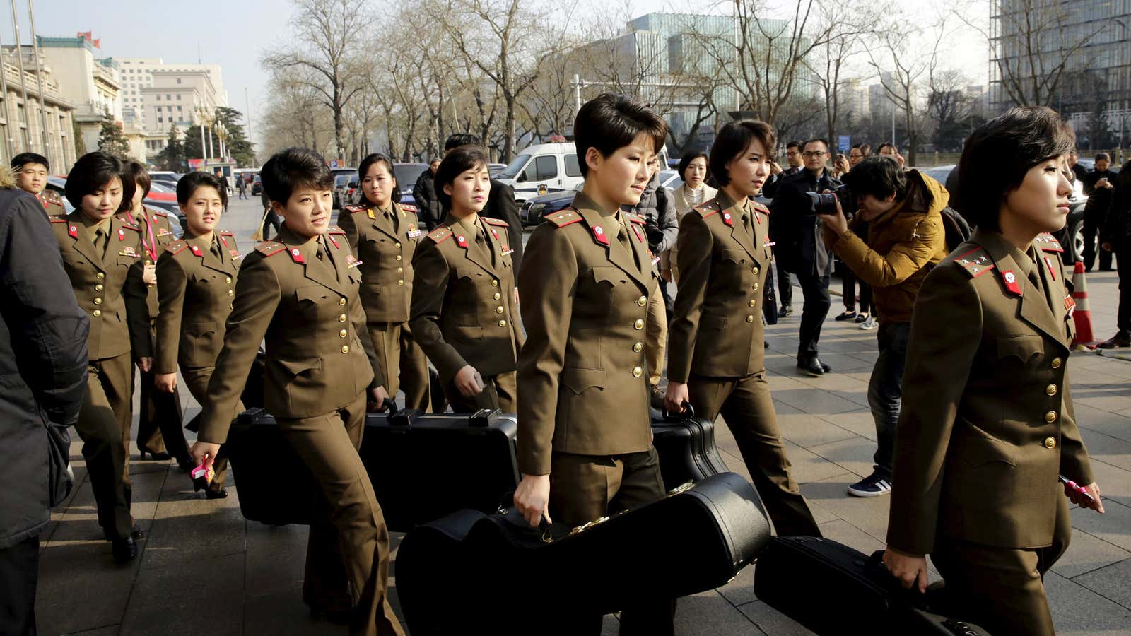 Moranbong Band leave their hotel in central Beijing.