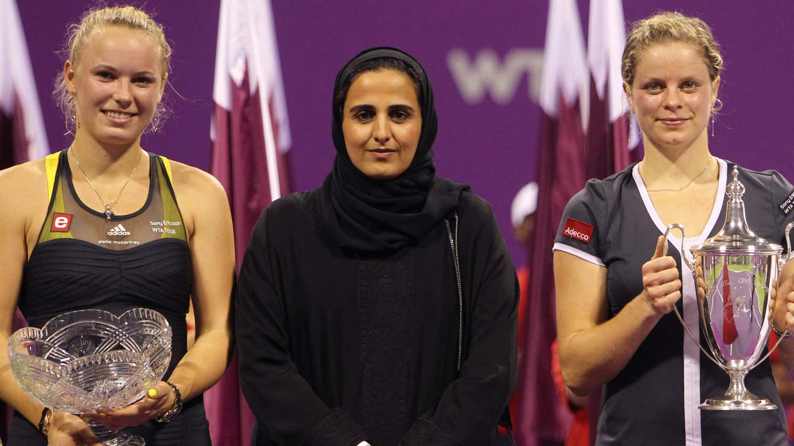 Sheikha Al-Mayassa between tennis players Caroline Wozniacki and Kim Clijsters at the WTA Championships in Doha.