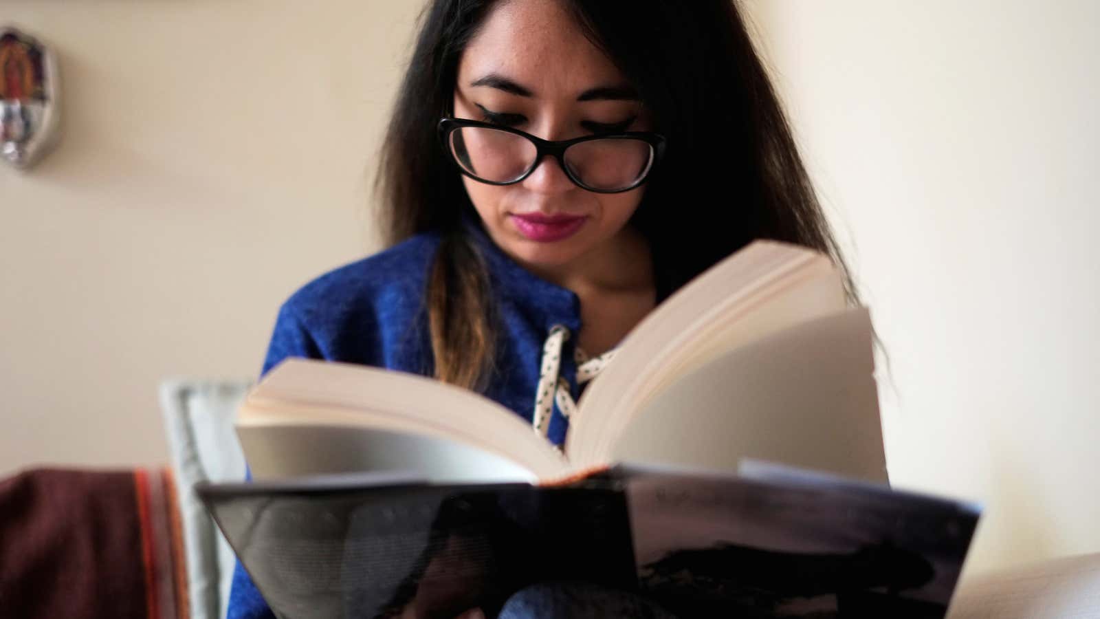 A woman reads a book in La Paz, Bolivia, September 14, 2018.