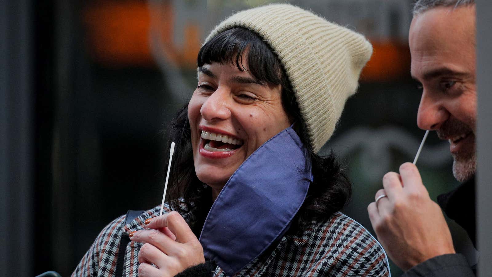 People laugh as they take COVID-19 tests at a pop-up testing site in New York