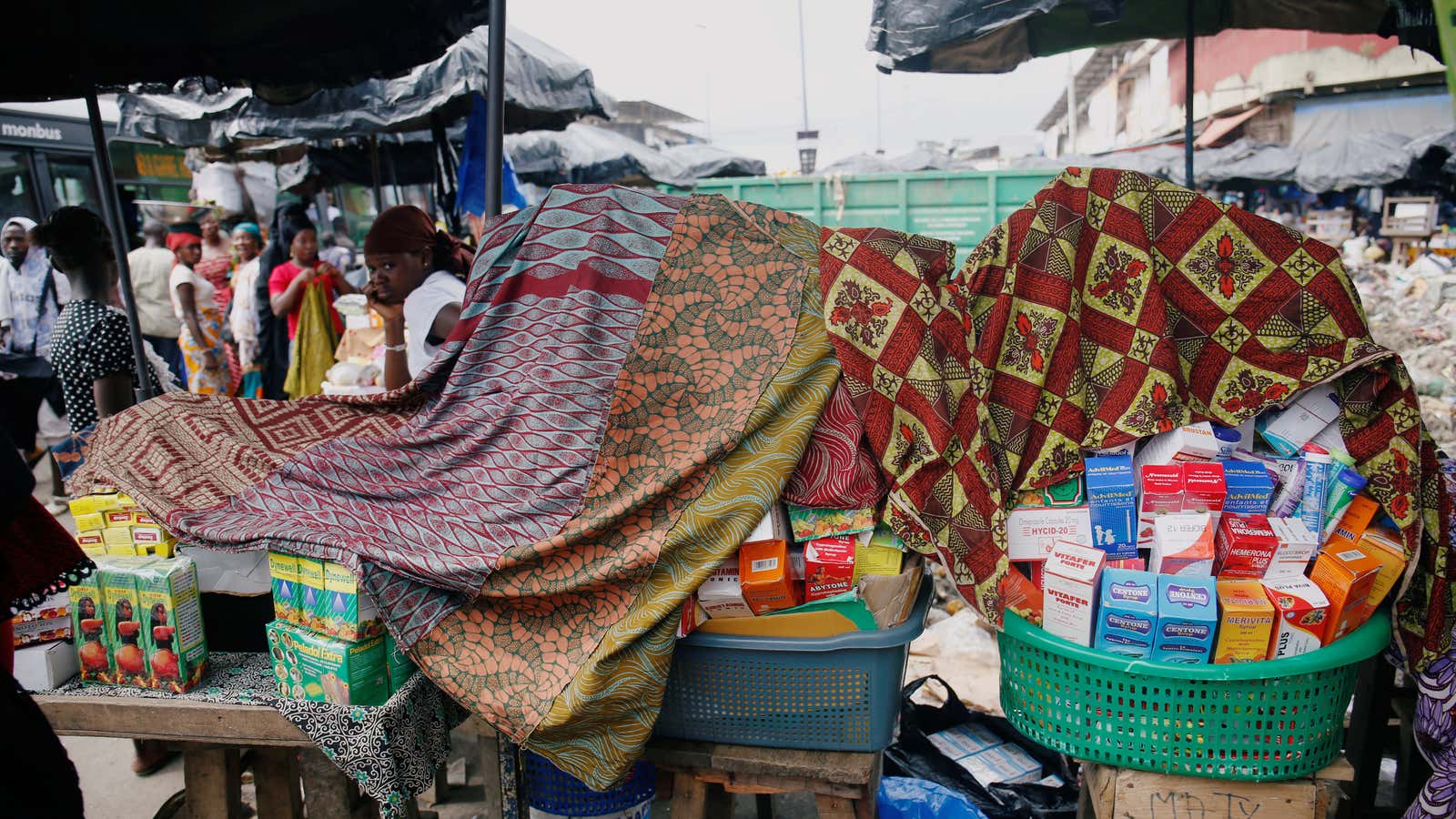 A street vendor sells illegal and false drugs in a street of Adjame in Abidjan, Ivory Coast