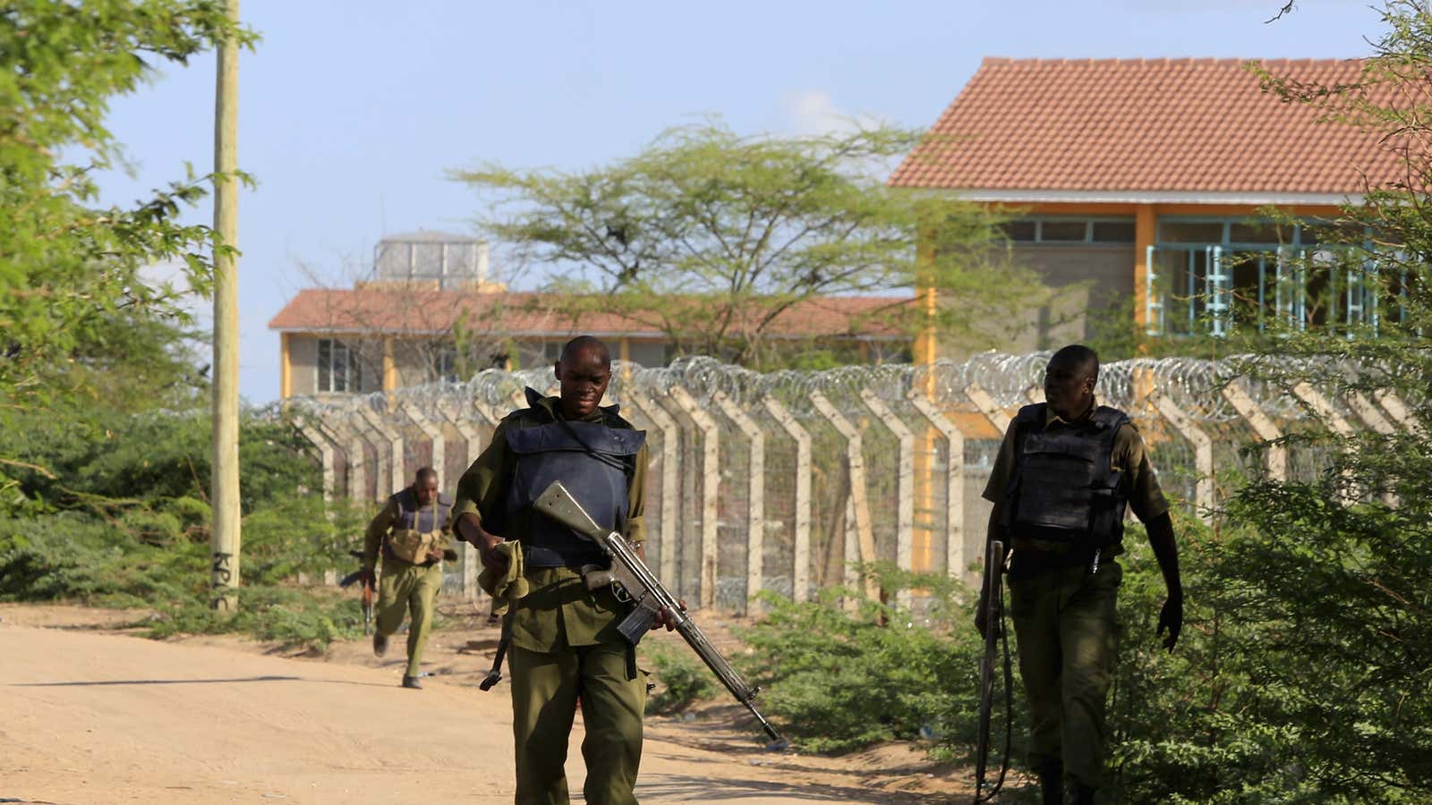 Kenyan security forces patrol the fenced border around Garissa University College.