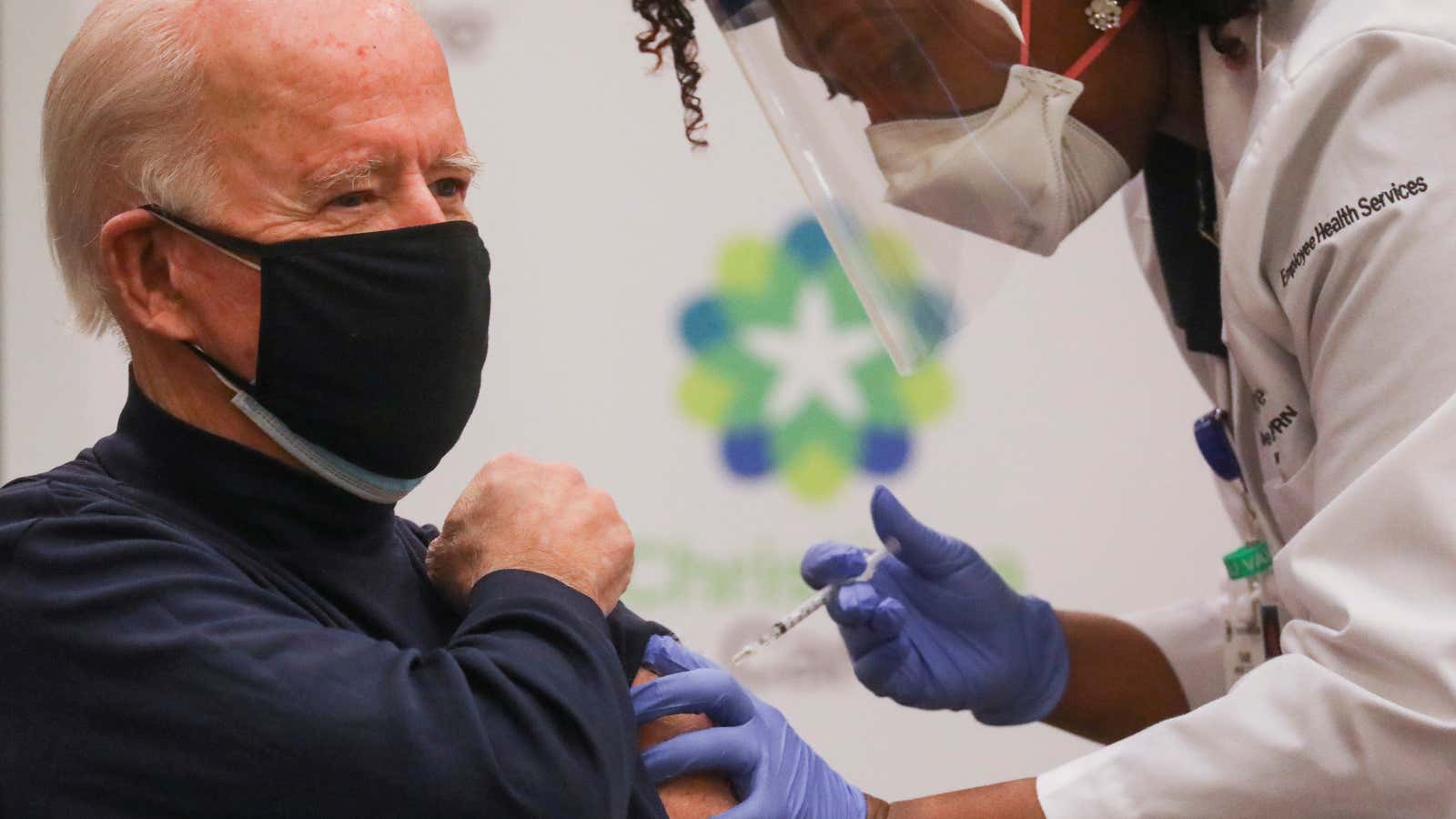 Nurse practitioner Tabe Mase gives US President-elect Joe Biden a vaccine dose